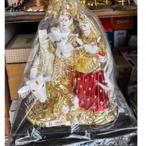 Gold Radha Krishna on Cow showpiece
