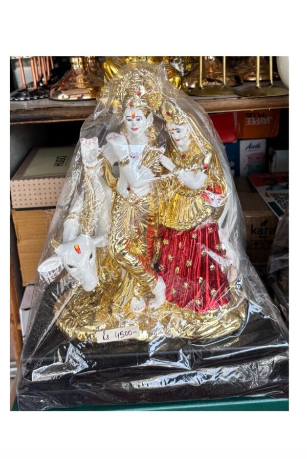 Gold Radha Krishna on Cow showpiece