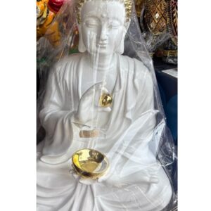 Meditating Buddha Idol with diya