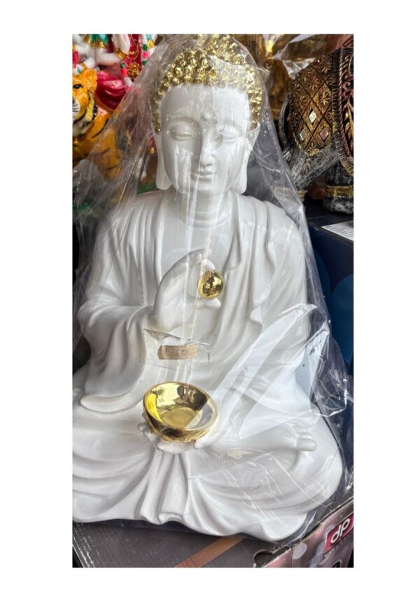 Meditating Buddha Idol with diya